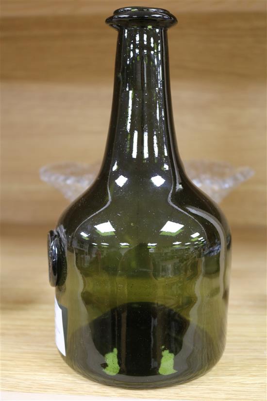 A cut glass bowl, two salts and a wine bottle, bottle height 23cm